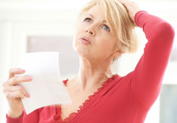 Middle aged woman having a hot flush to represent the menopause