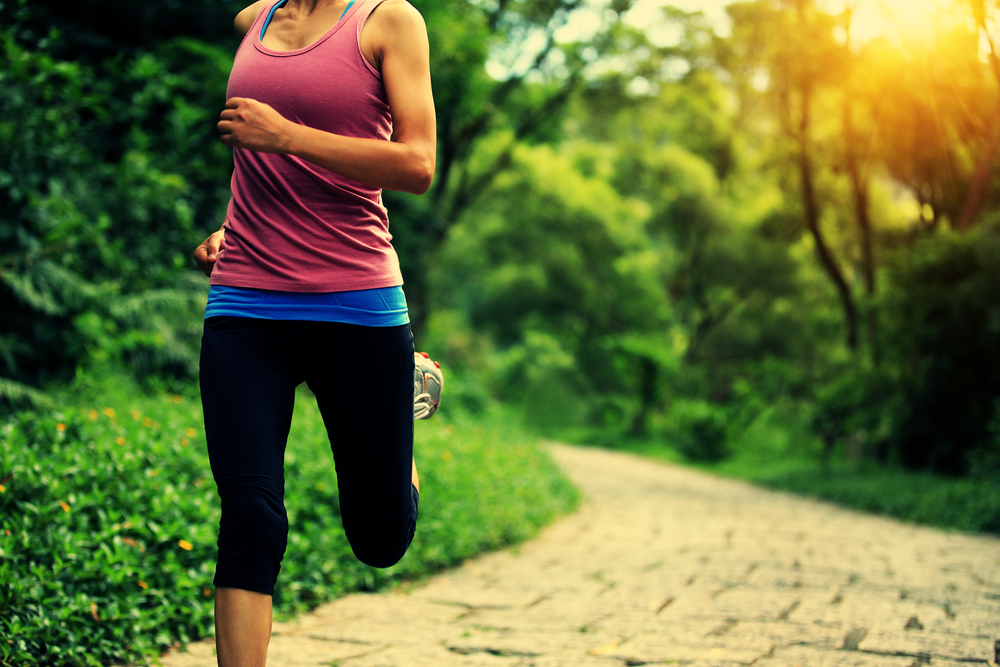 Close up of woman running in a park