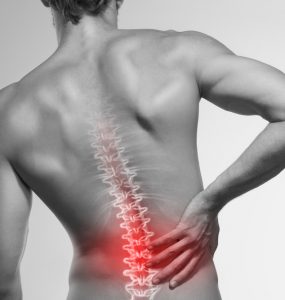 A black and white picture of a man's back with the spine and lower back highlighted red to represent back pain