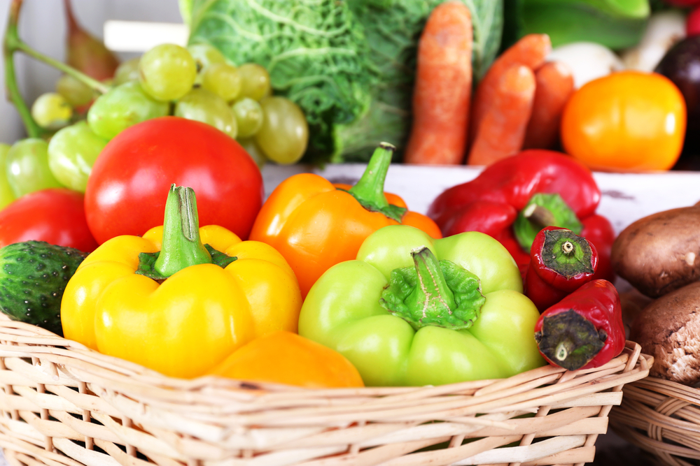 Close up of a basket of colourful fruit and vegetables