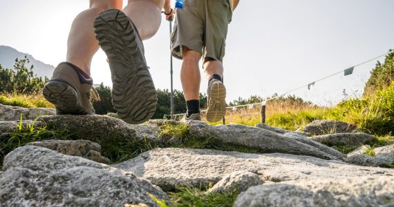 Close up of two hikers walking