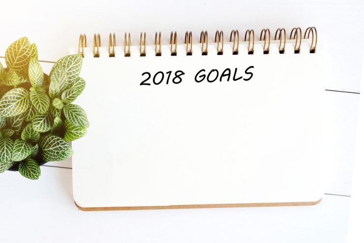 A note pad with 2018 goals written at the top in order to plan health goals