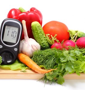 A diabetes blood glucose monitor among health vegetables