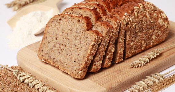 Wholewheat bread loaf with a scoop of flour