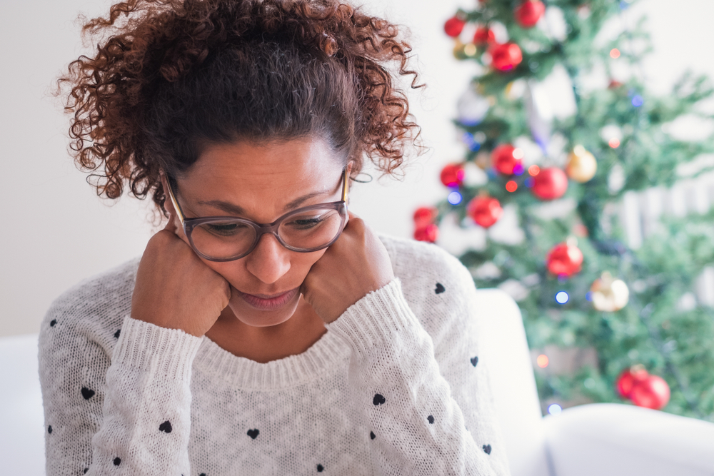 Close nup on woman at christmas looking stressed
