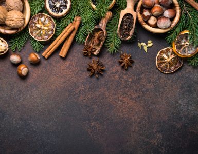 A range of christmas spices on a dark background