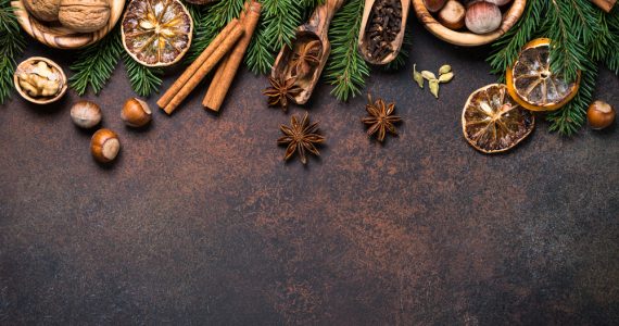 A range of christmas spices on a dark background