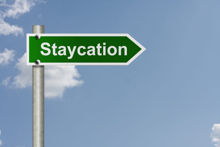 A road sign saying 'staycation'