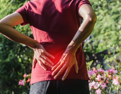 Close up of woman's back representing a gardening injury