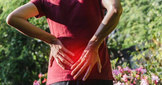 Close up of woman's back representing a gardening injury