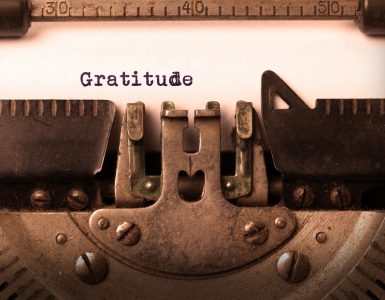 The word gratitude being typed with a typewriter