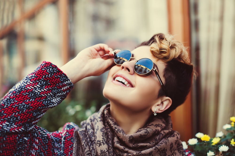 Close up of woman wearing sunglasses in winter
