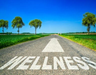 Road with the word 'Wellness' written on it with an arrow