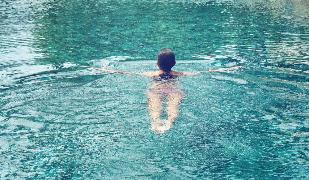 Woman swimming outdoors