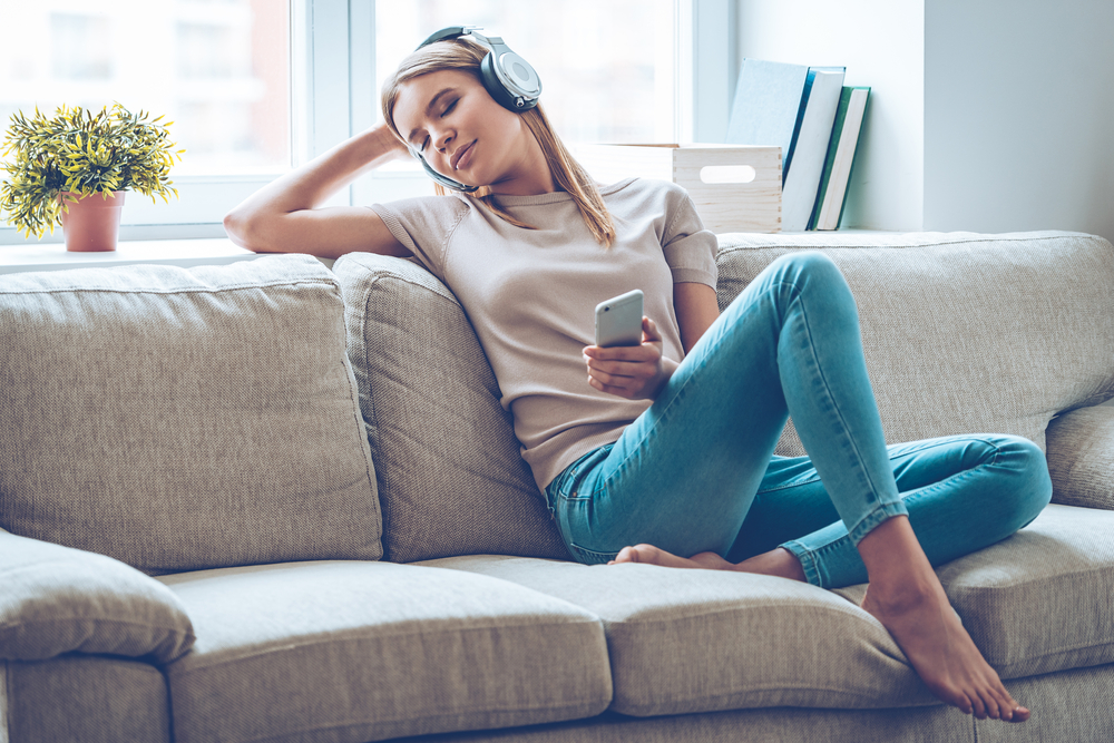 Woman listening to music with headphones and relaxing