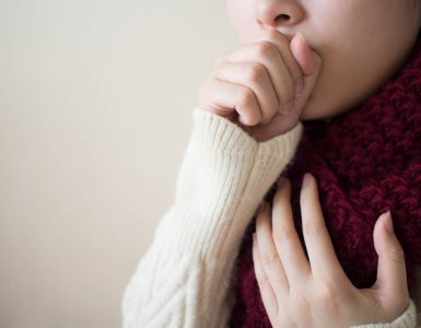 Close up of woman coughing