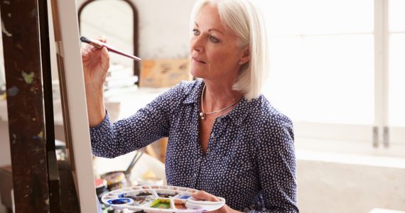 Middle aged woman painting
