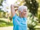 Older woman stretching and exercising outdoors