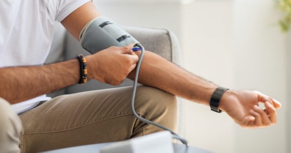 Close up of man taking blood pressure reading