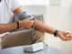 Close up of man taking blood pressure reading