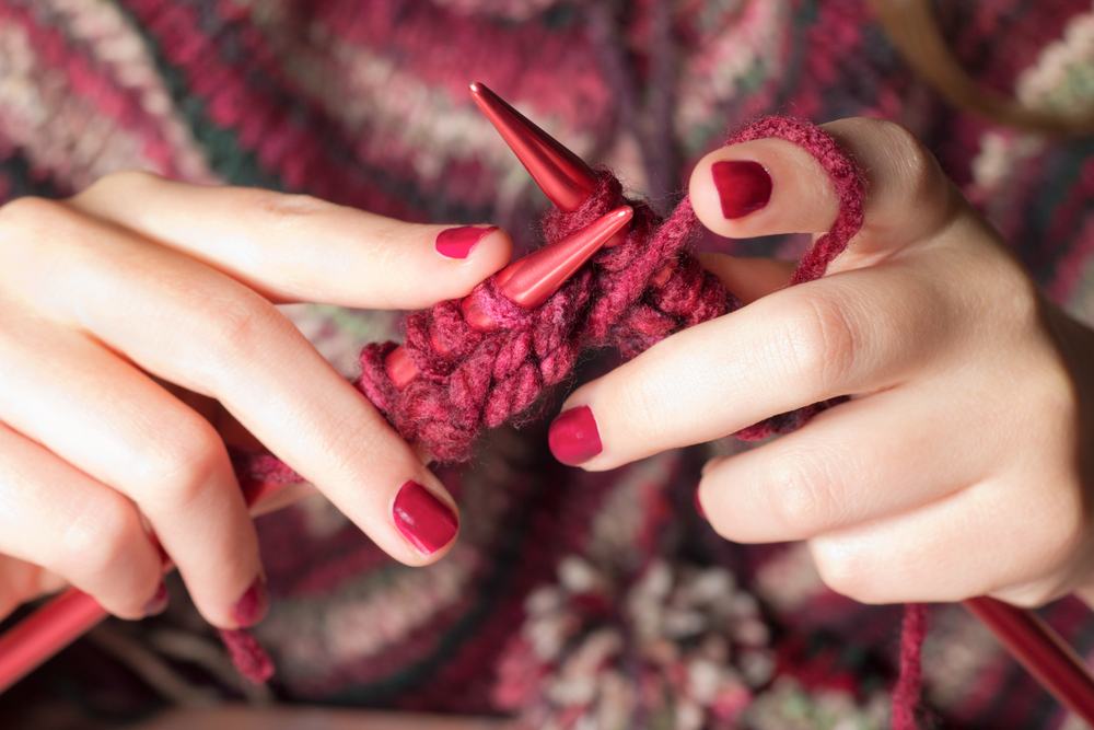 Close up of a woman knitting