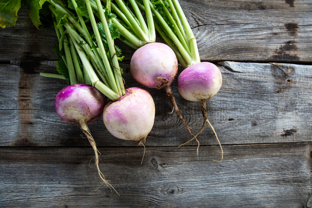 Turnips on a wooden background