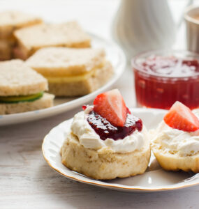 A traditional afternoon tea with close up of scone