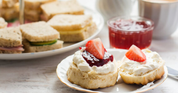 A traditional afternoon tea with close up of scone